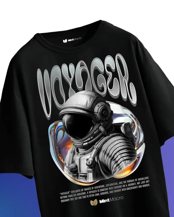 Oversized T-shirt laid flat featuring a graphic of a lone astronaut in space with bold text underneath, on a neutral background