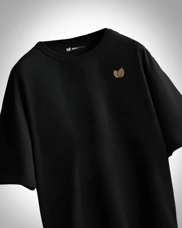 Oversized plain black T-shirt laid flat against a white background