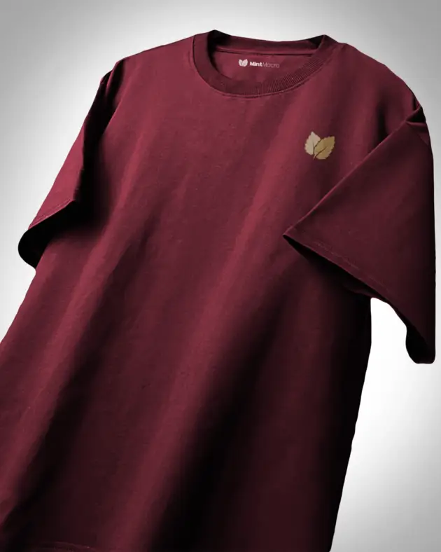 Oversized plain red maroon T-shirt laid flat against a white background