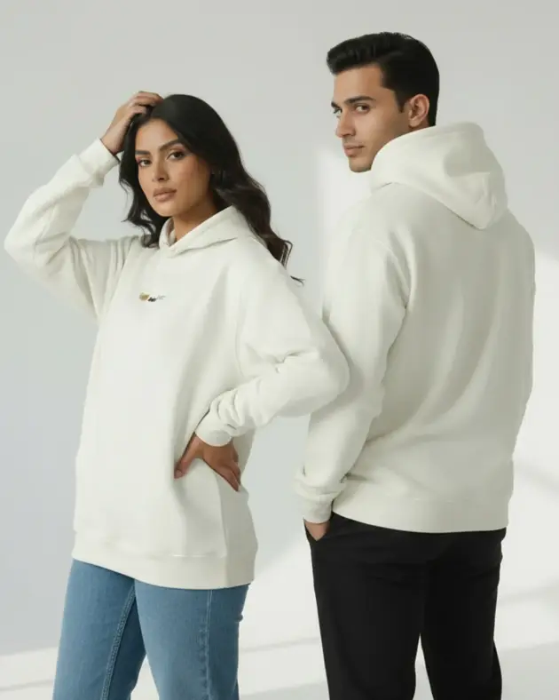 Beige oversized unisex hoodie by Mintmacro worn by male and female models, featuring a relaxed fit minimalist streetwear design.